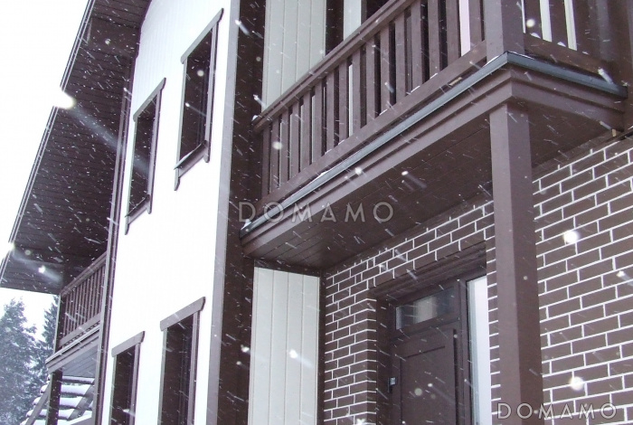 Проект дома из газобетона с цокольным этажом и небольшим бассейном