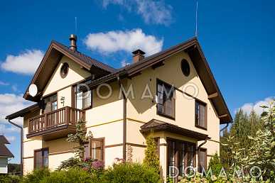 Проект дома из газобетона с эркером и спальней на первом этаже