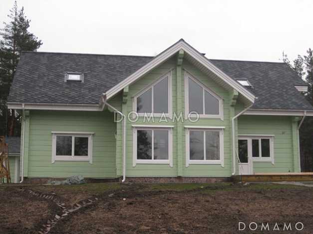 Проект деревянного дома из клееного бруса с большим эркером который является архитектурным украшением всего дома