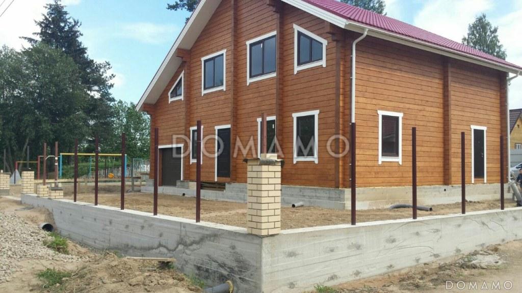 Проект деревянного дома из клееного бруса с встроенным гаражом / 2