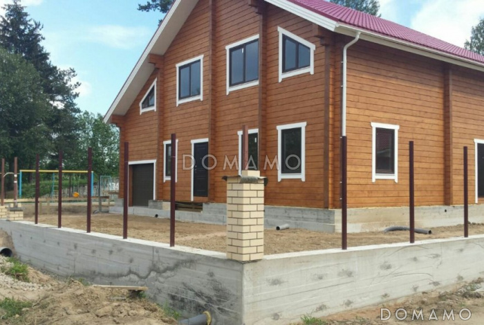 Проект деревянного дома из клееного бруса с встроенным гаражом Проект деревянного дома из клееного бруса с встроенным гаражом