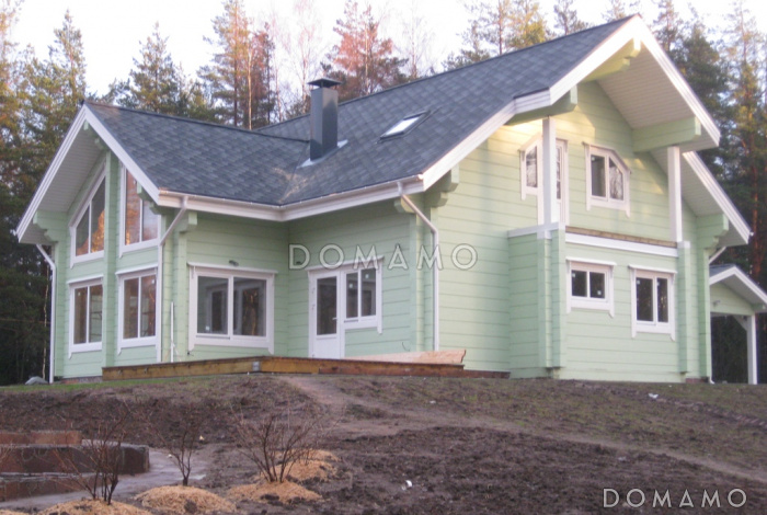 Проект деревянного дома из клееного бруса с большим эркером который является архитектурным украшением всего дома