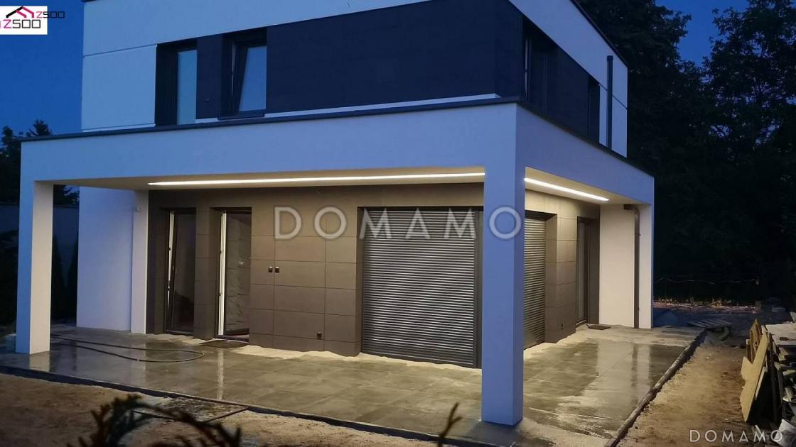 Проект современного двухэтажного дома из газобетона с плоской крышей, четырьмя комнатами и угловым остеклением гостиной / 13