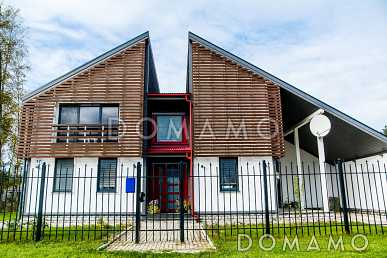 Проект современного дома из пеноблоков с изолированной кухней