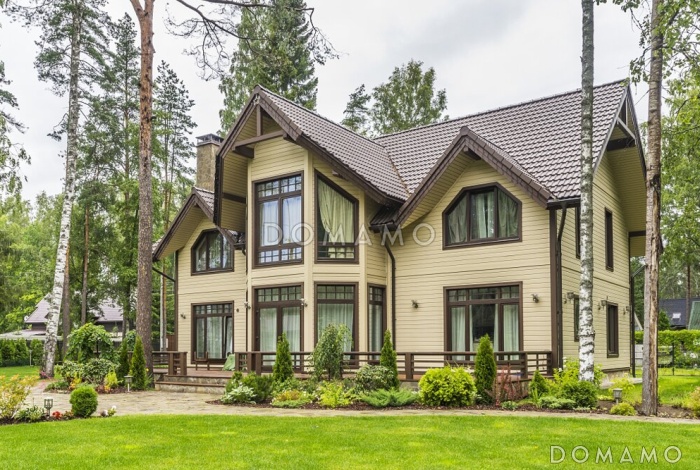 Проект каркасного дома в скандинавском стиле с террасой, эркером и большими окнами