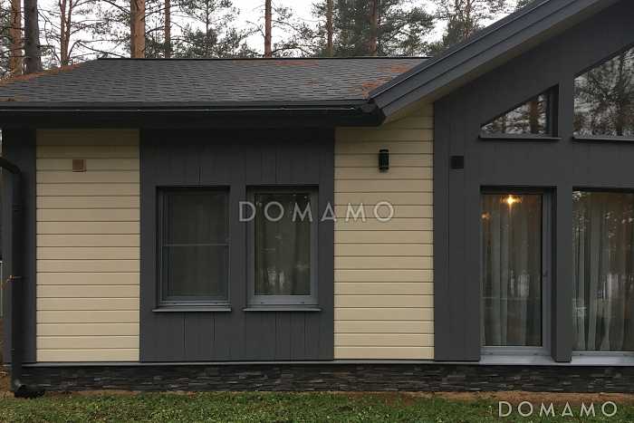 Проект скандинавского дома из кирпича с 2 спальнями, светлой гостиной и крытой террасой